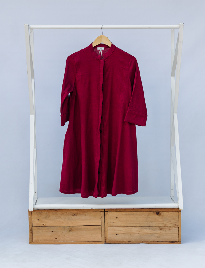 Display of burgundy linen dress.