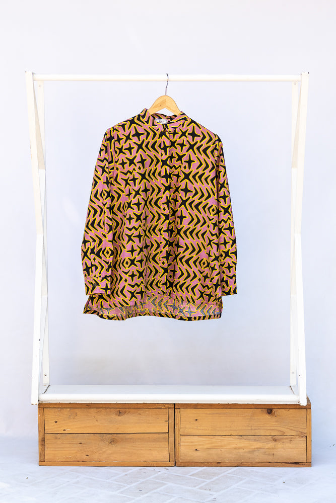 Display of beige, yellow and black geometric print shirt.
