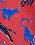 Close up display of red cat print dress, fabric.