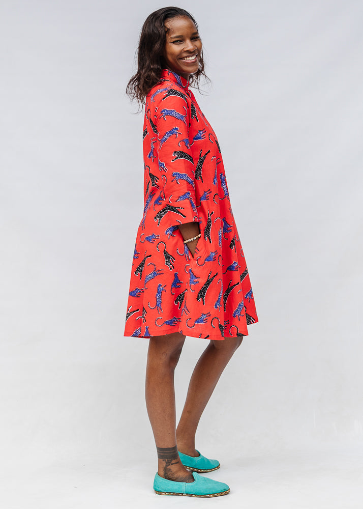 Model wearing red cat print dress.