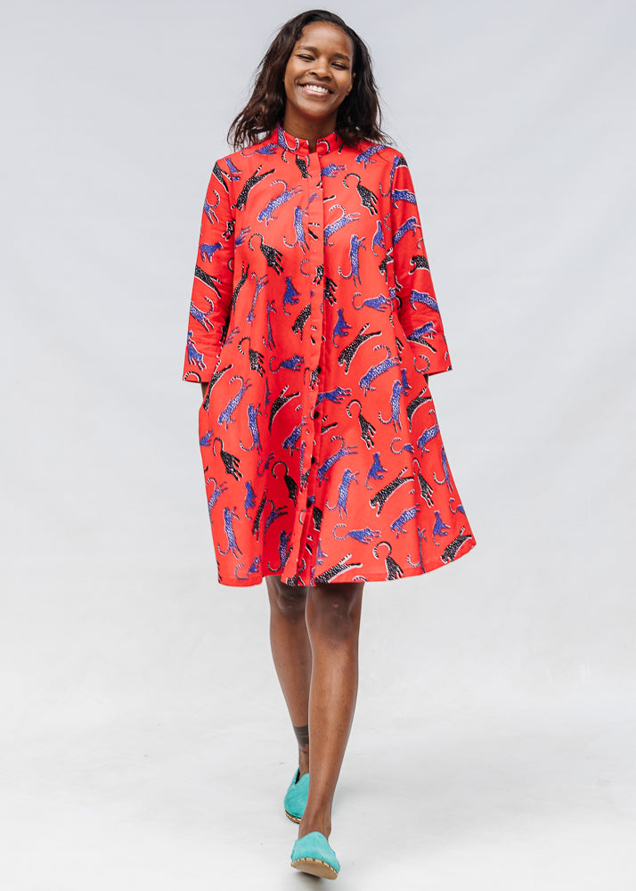 Model wearing red cat print dress.