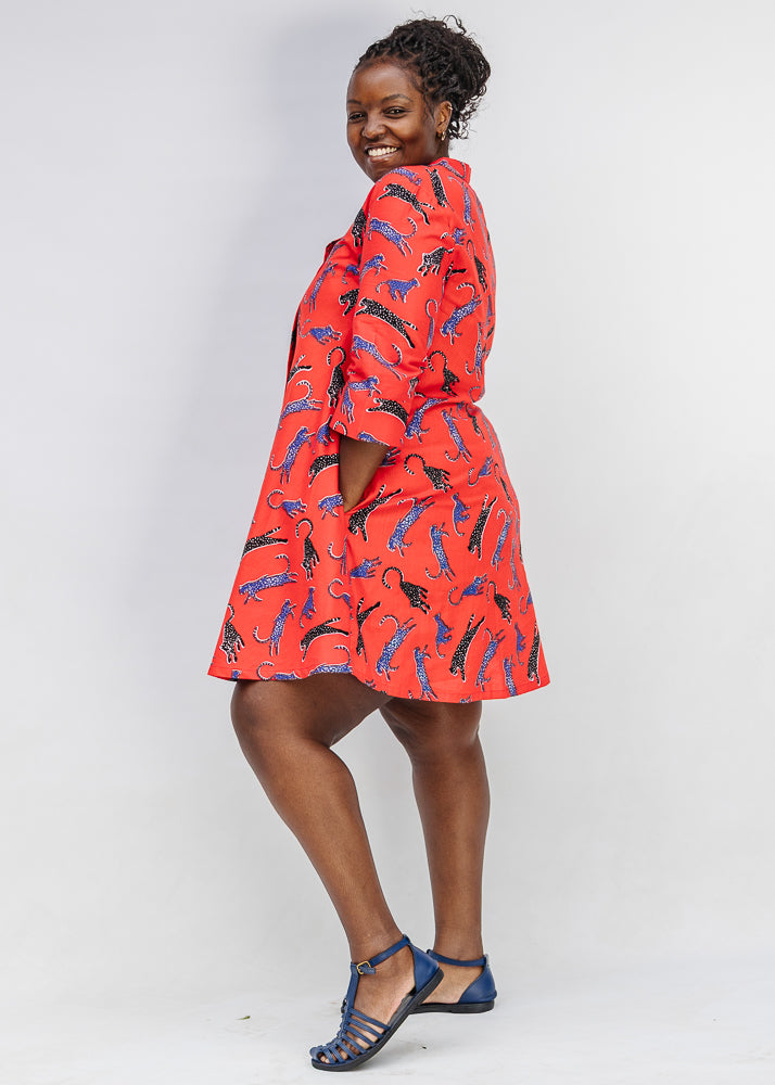 Model wearing red cat print dress.