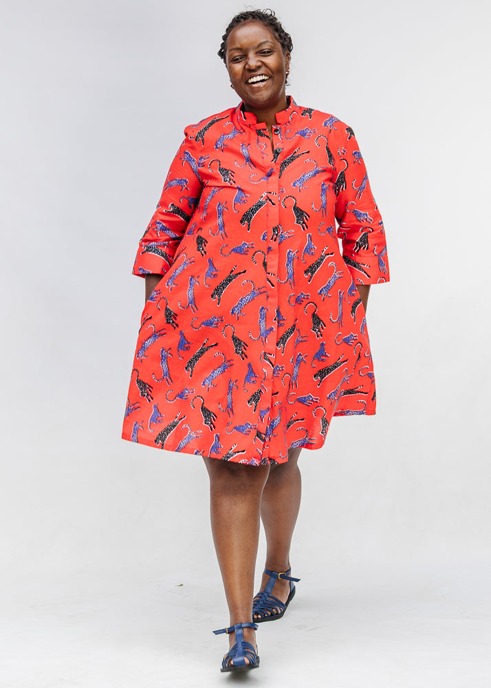 Model wearing red cat print dress.