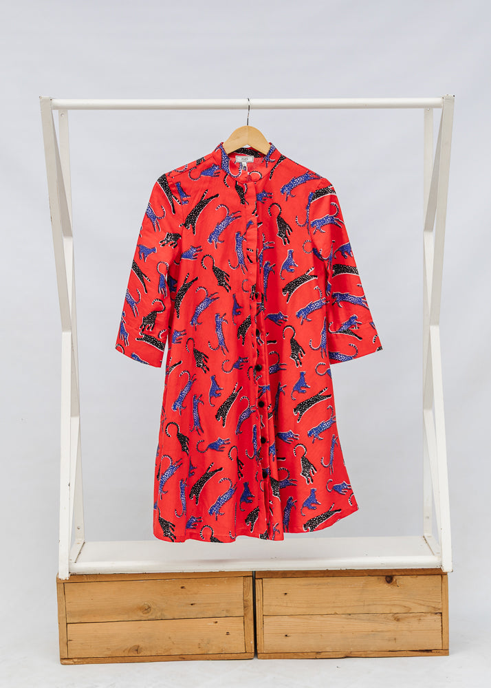 Display of red cat print dress.