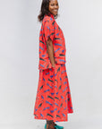 Model wearing red cat print shirt and culotte.