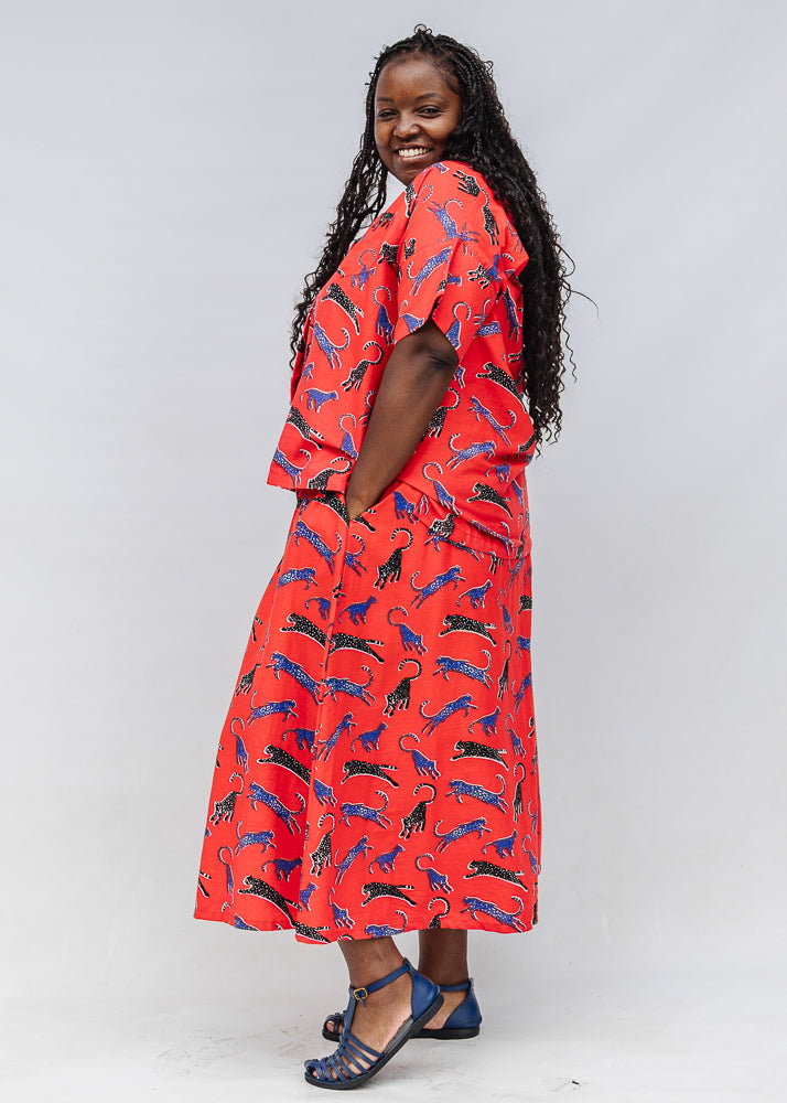 Model wearing red cat print shirt and culotte.