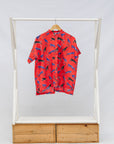 Display of red cat print shirt.