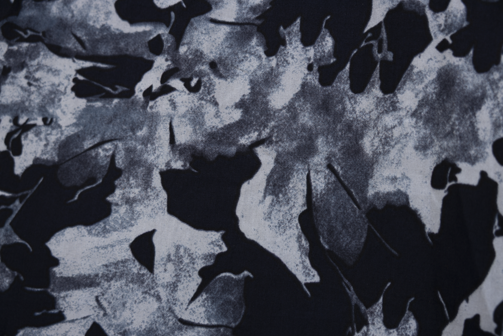 Close up display of navy and gray abstract print maxi dress.