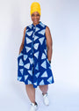 Model wearing blue sleeveless dress with white triangle print.