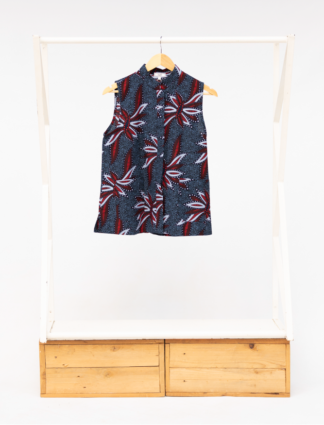 Display of navy and red sleeveless shirt.