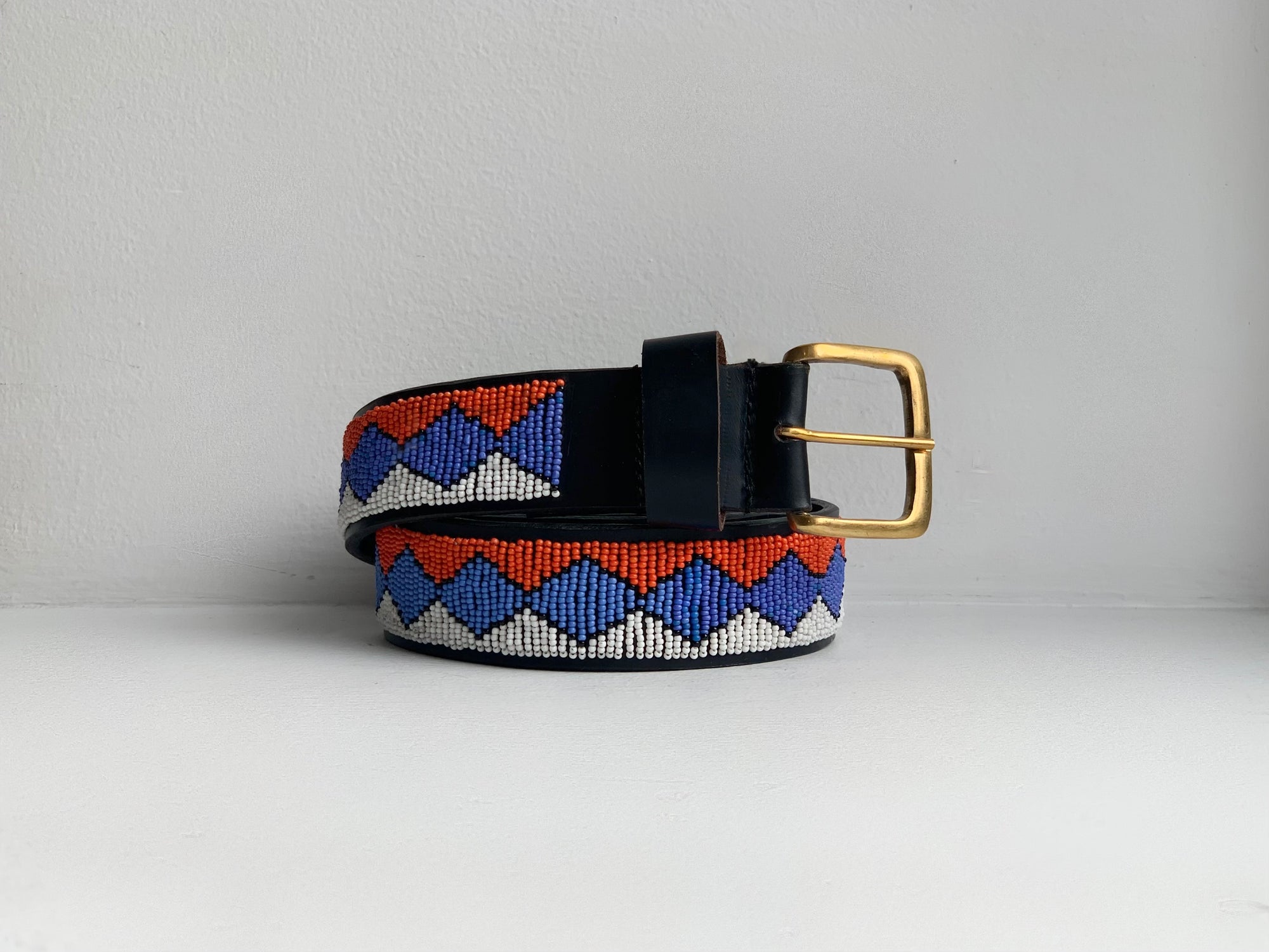 orange, blue and white geometric patterned beaded belt