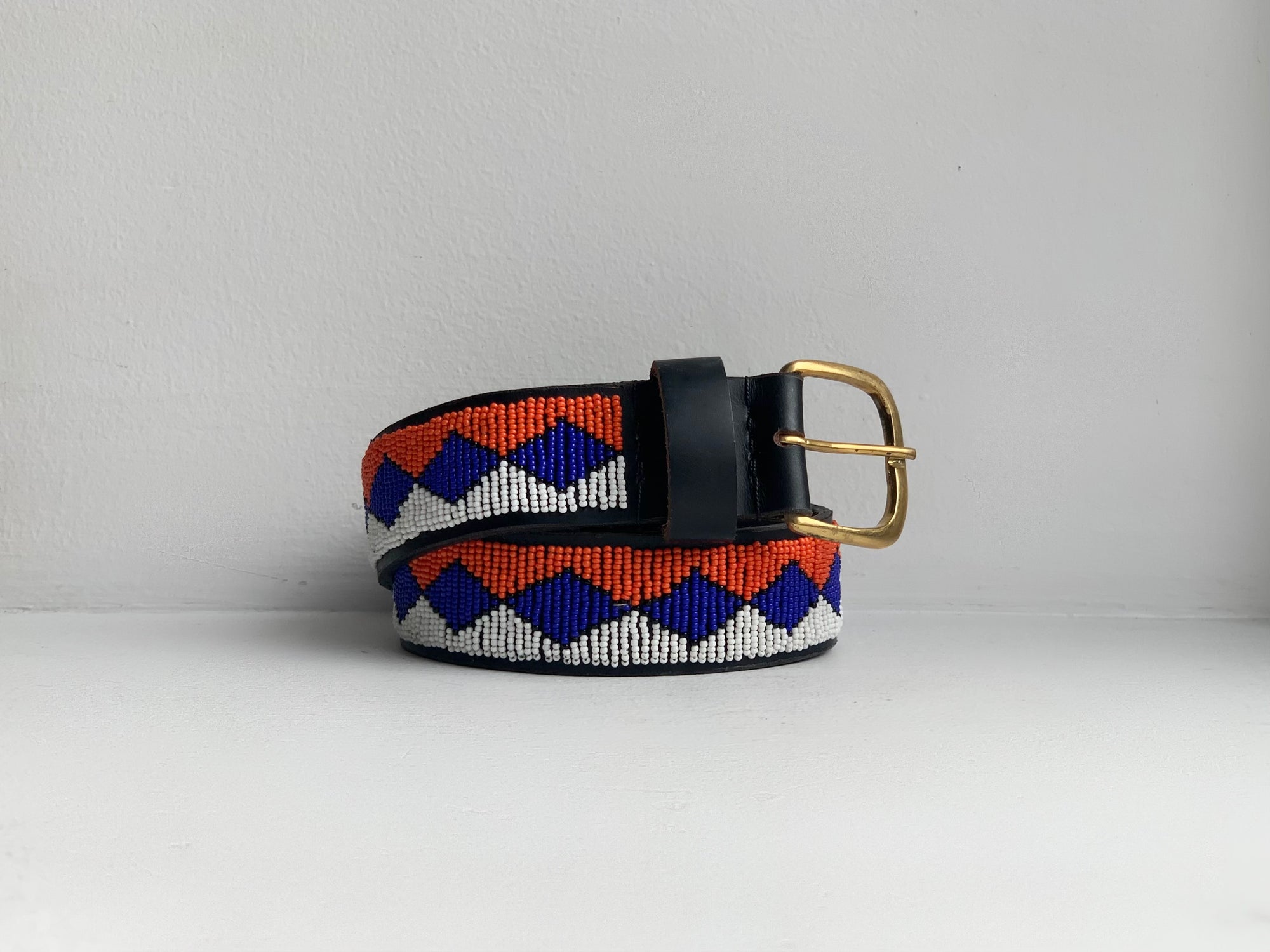 orange, blue and white geometric patterned beaded belt