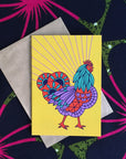 Multi-colored rooster with yellow background