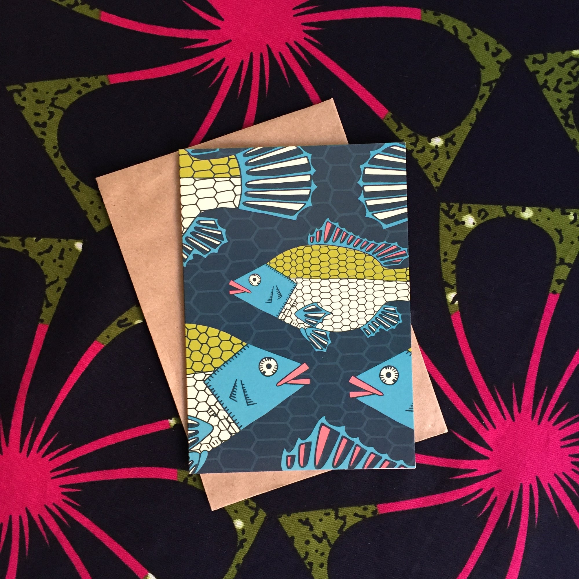 Drak blue greeting card with tilapia fish