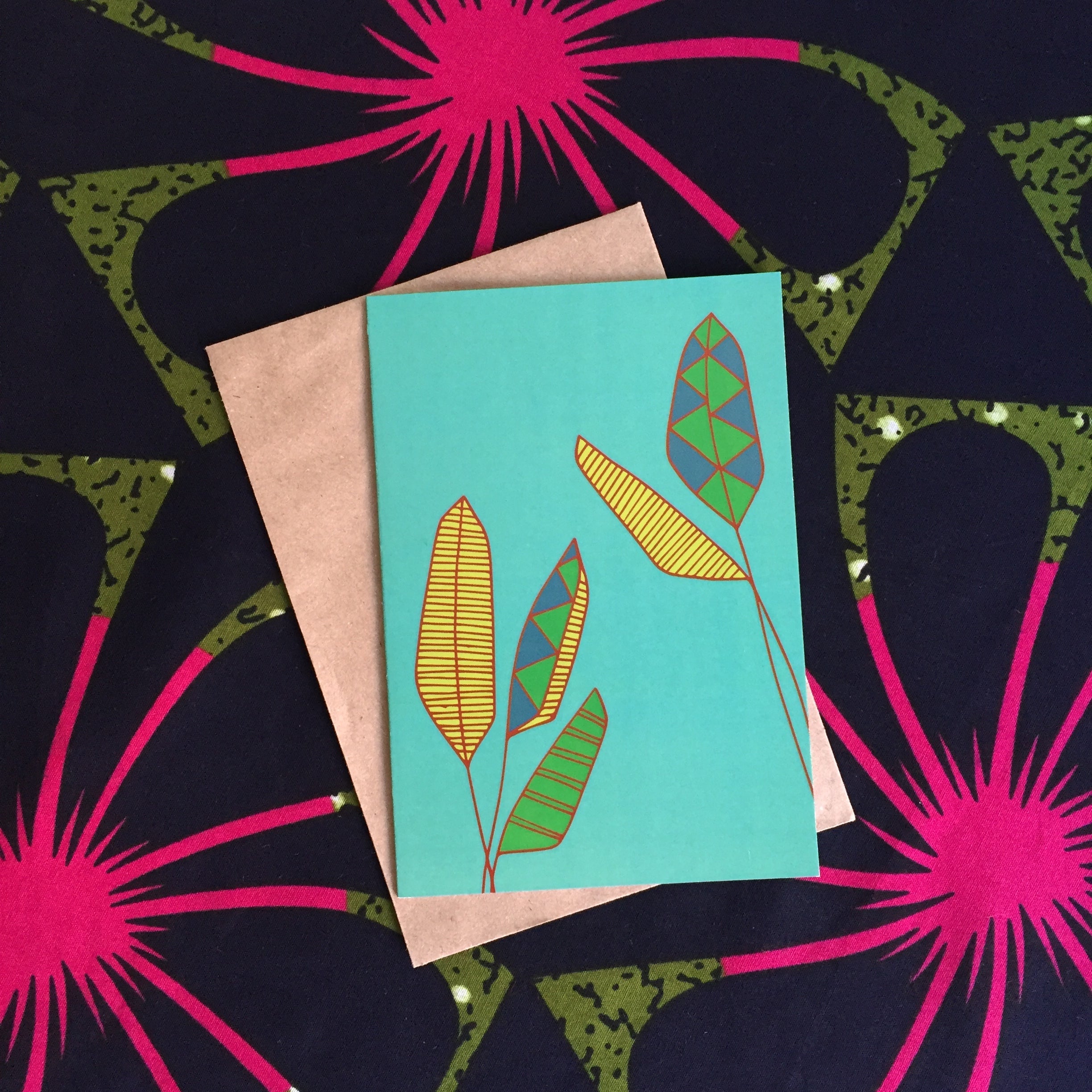 Turquoise Greeting card with yellow, green and red palms