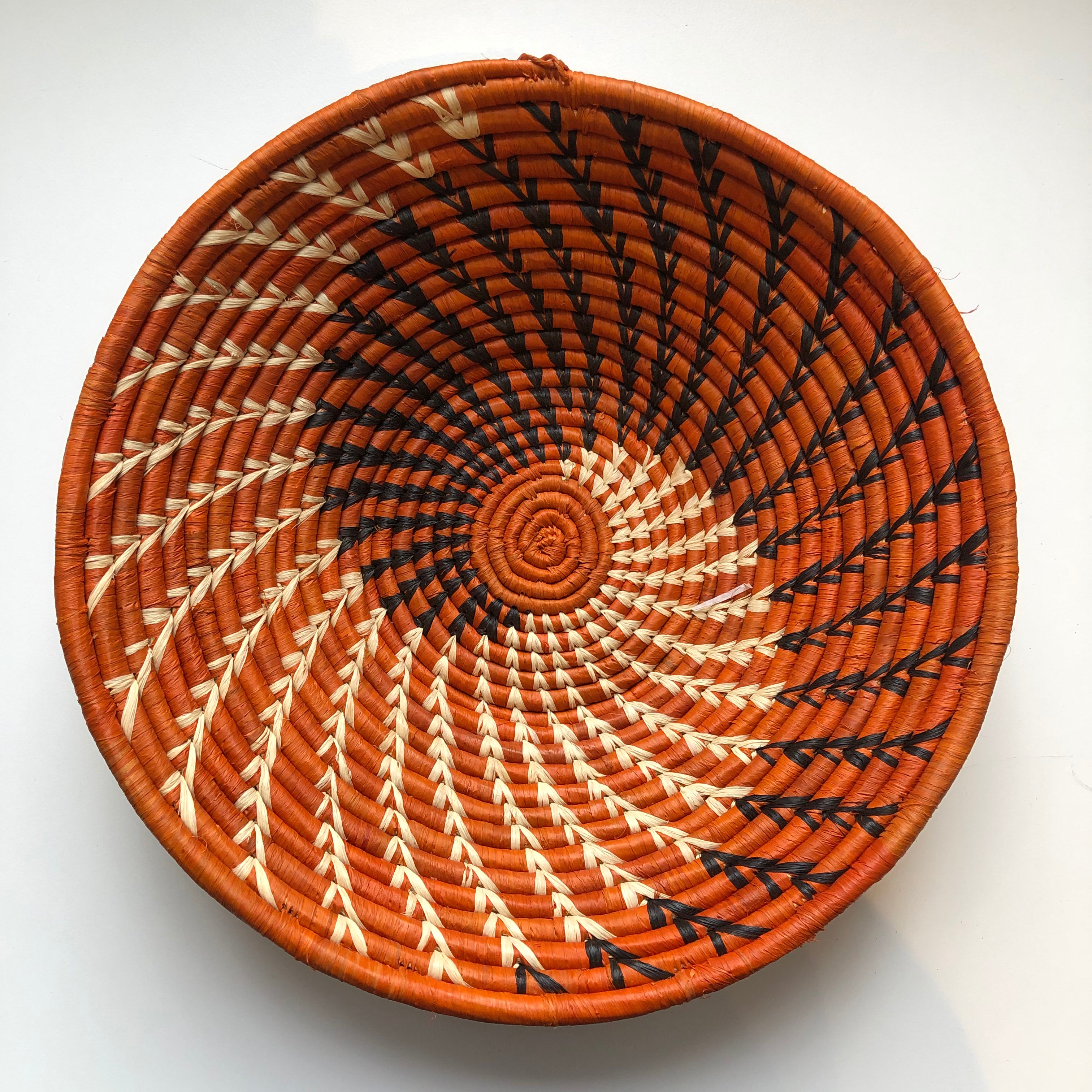 Orange and black swirl woven bowls
