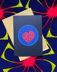 The display of blue greeting card with a red heart