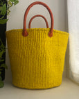 yellow basket with leather handles