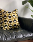 Display of 20x20 black, white and mustard pillow case
