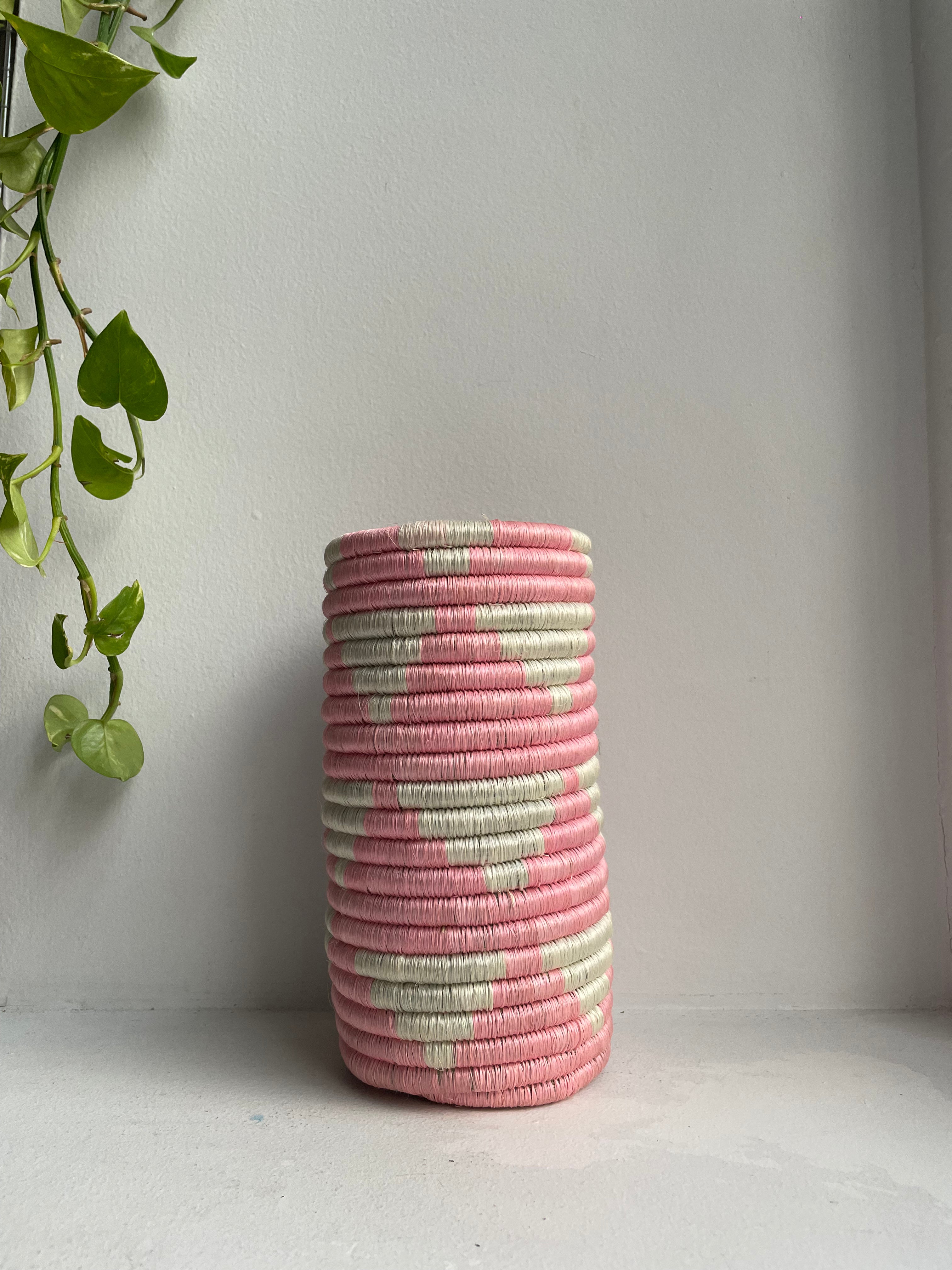 Display of bubble gum pink and white colored vase