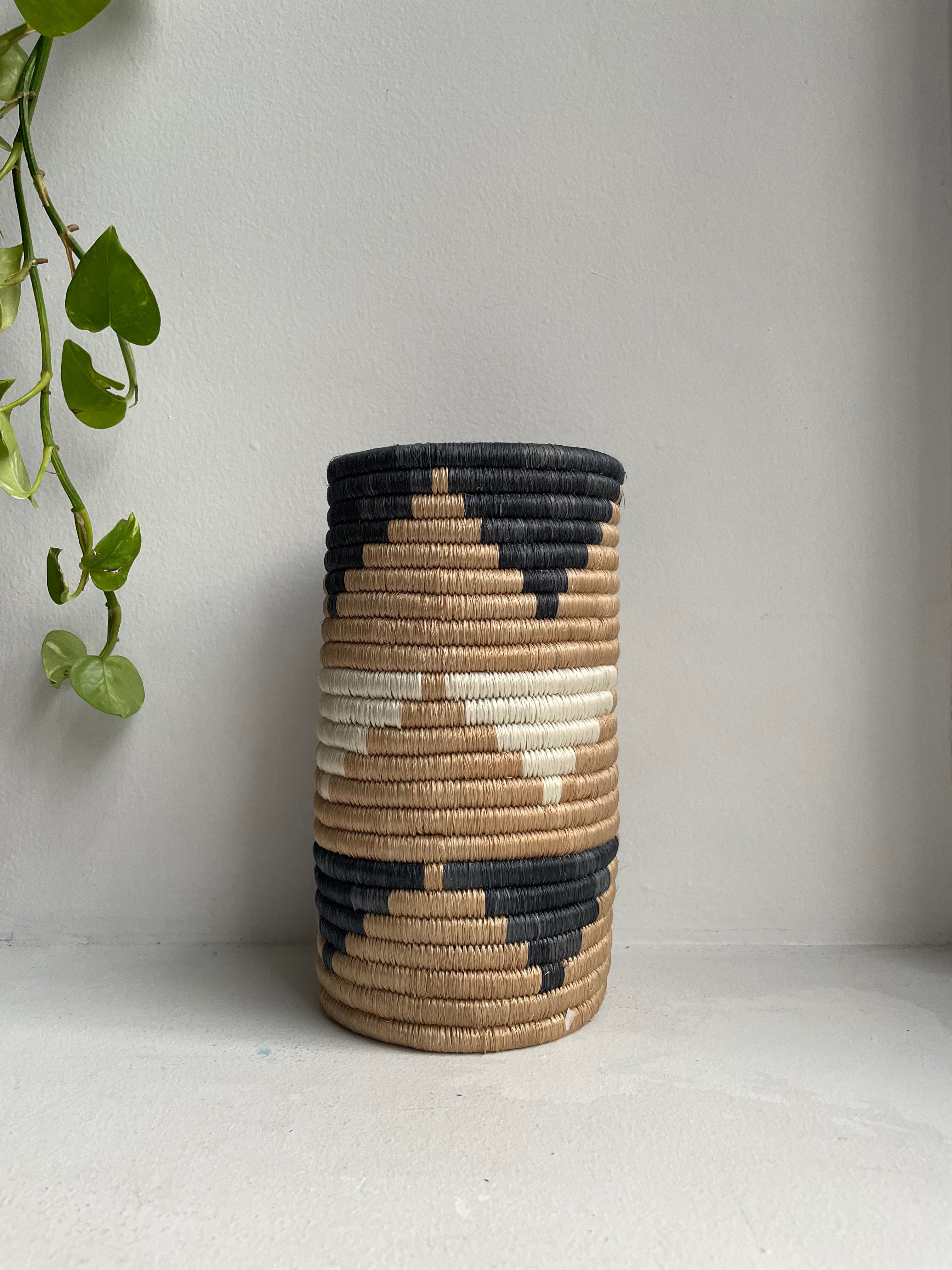 Display of black and white triangle vase