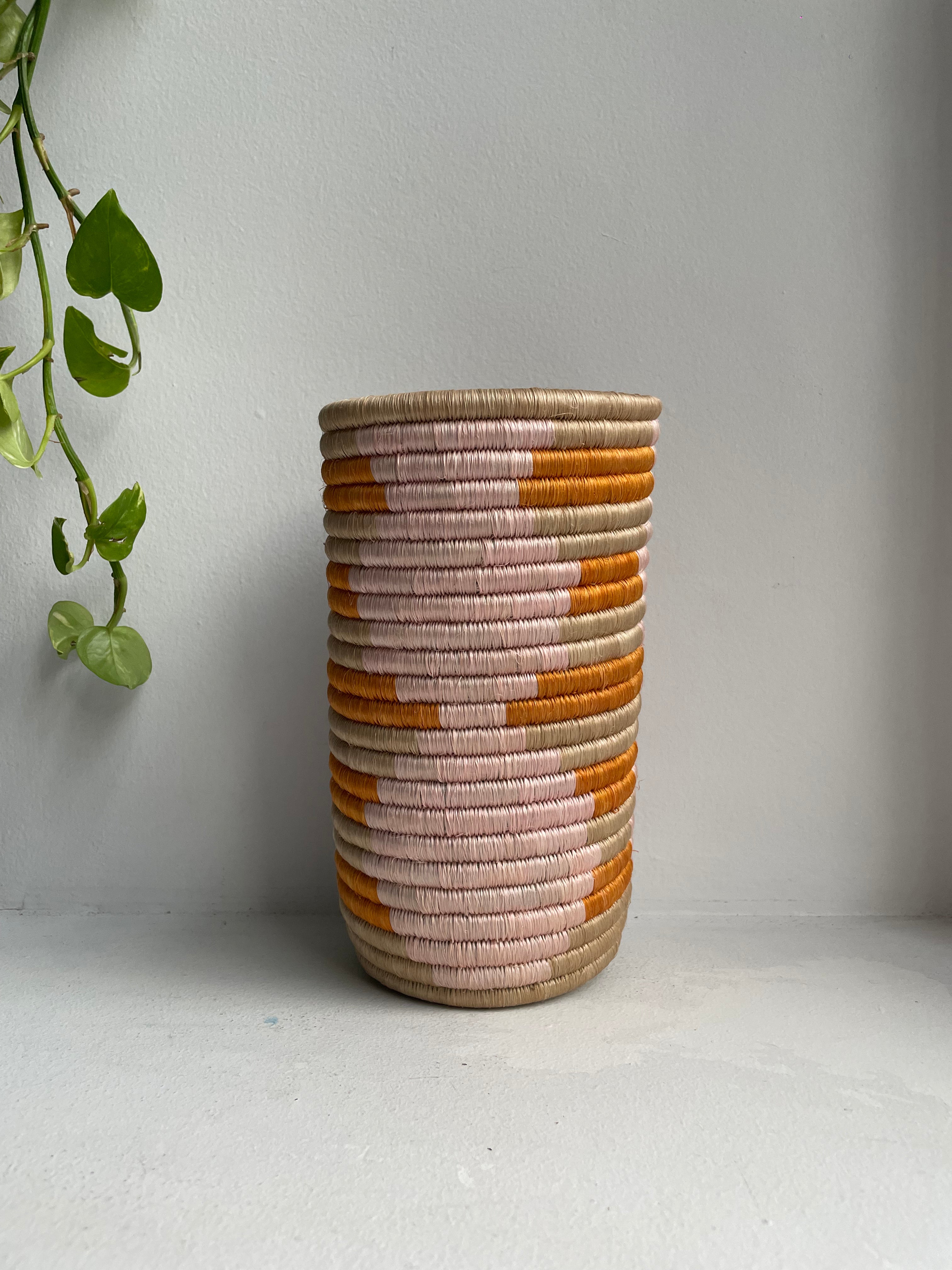 Display of bubble gum pink , orange and beige colored vase