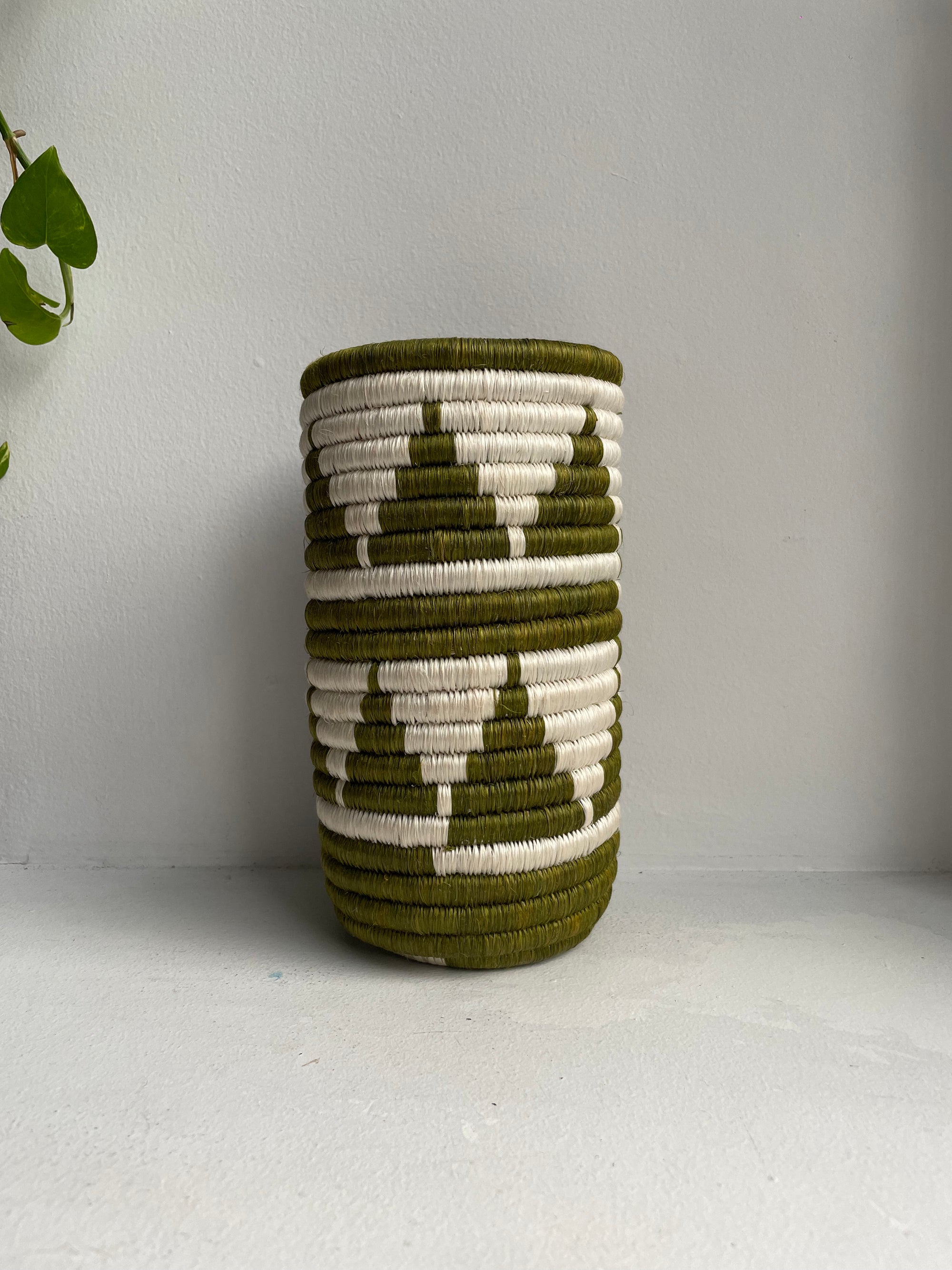 Display of khaki triangle vase