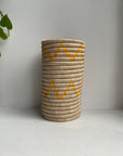 Display of orange triangle striped vase