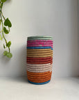 Display of multicolored striped vase