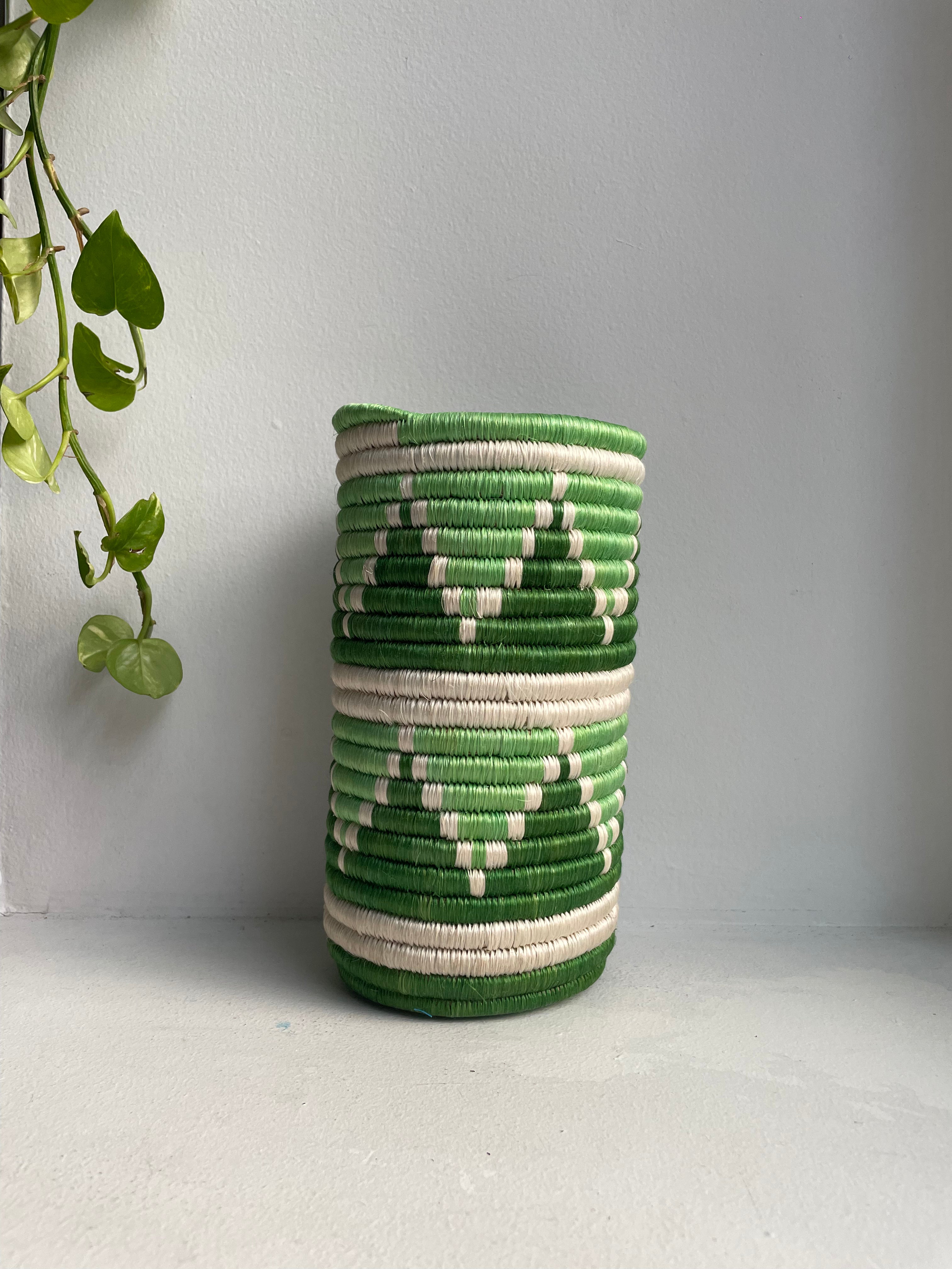 Display of white, green and pastel green triangle vase
