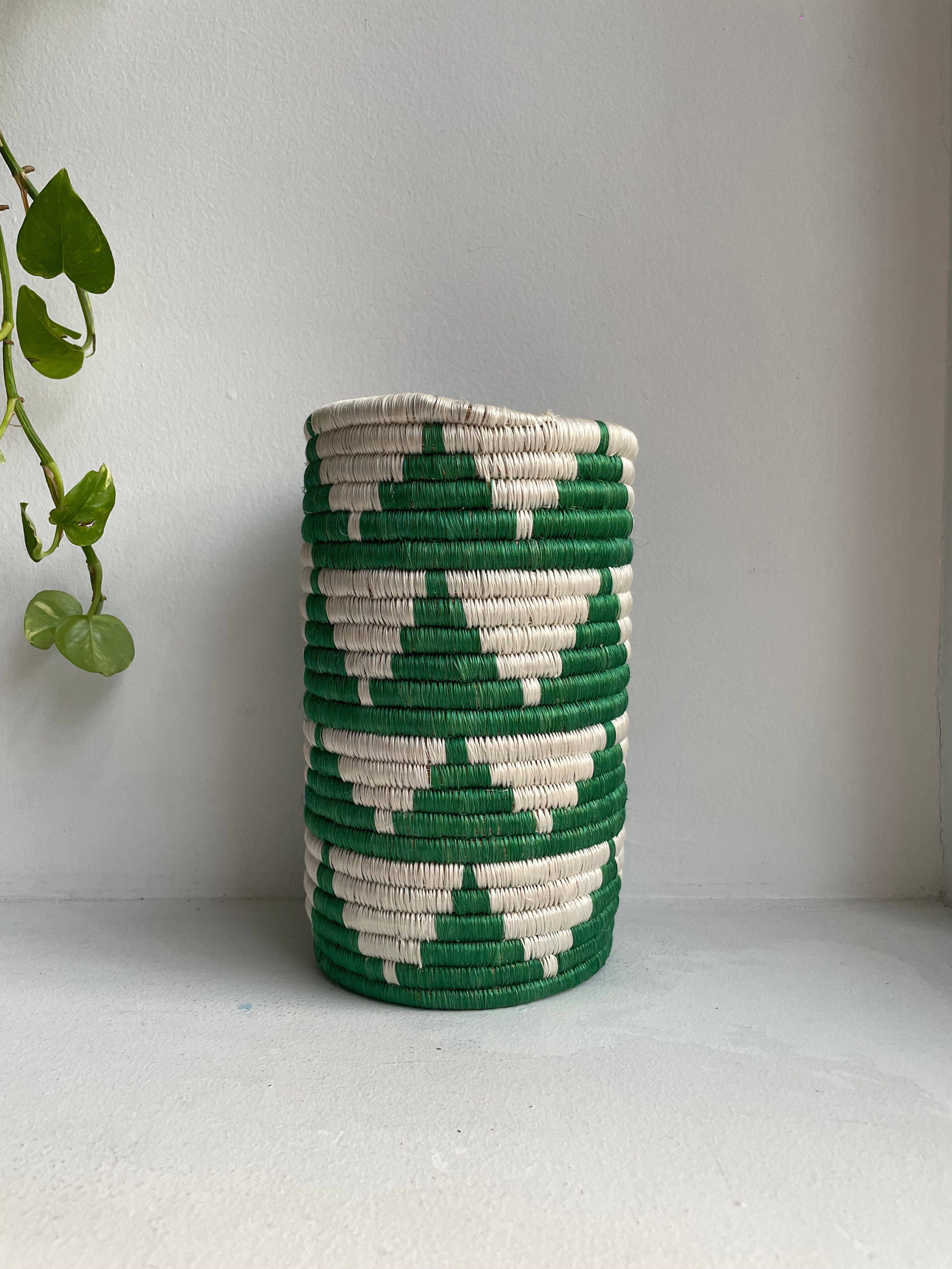 Display of white and green colored vase 