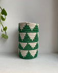 Display of white and green colored vase 