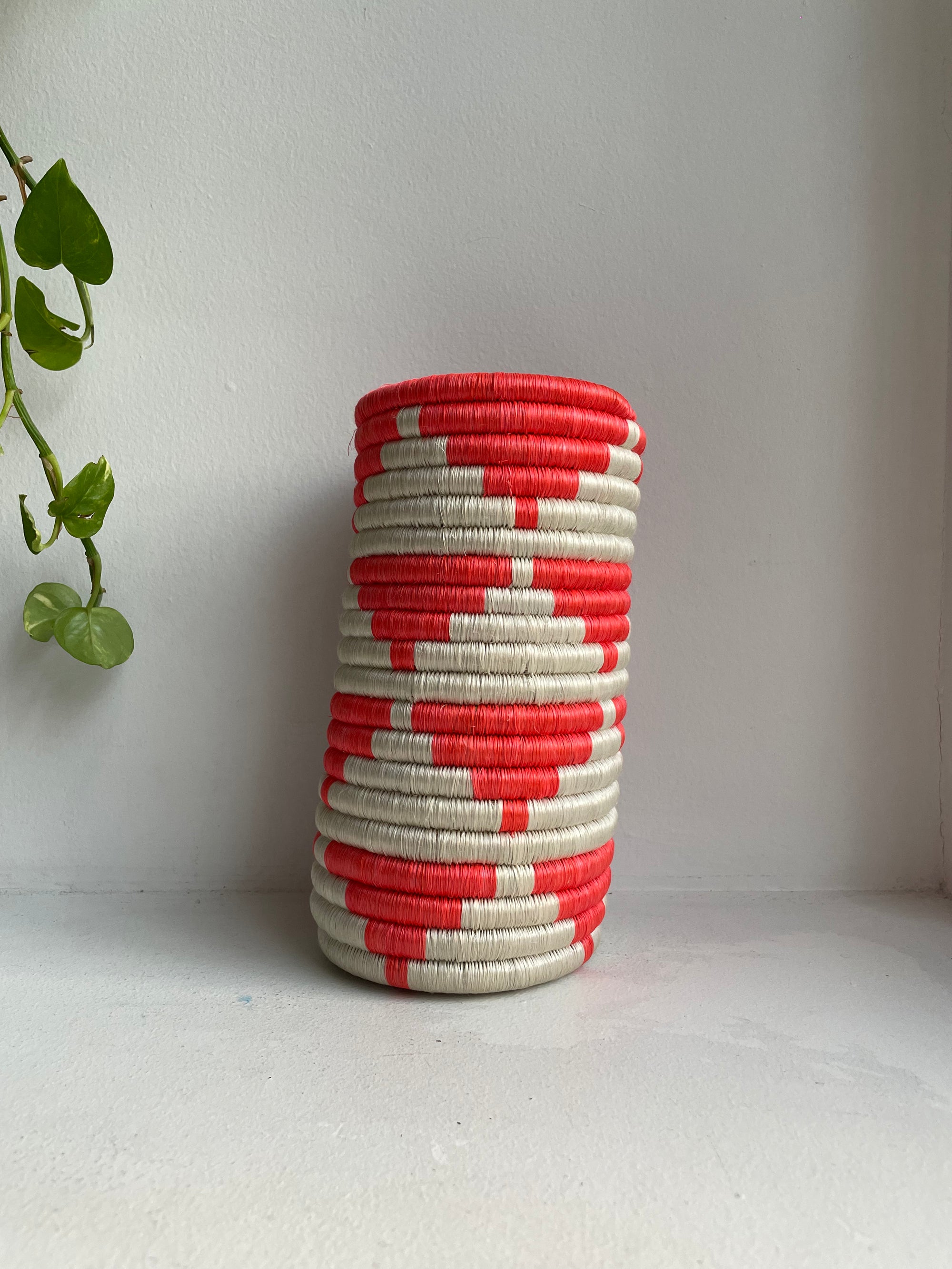 Display of white and hot pink triangle vase