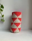 Display of white and hot pink triangle vase