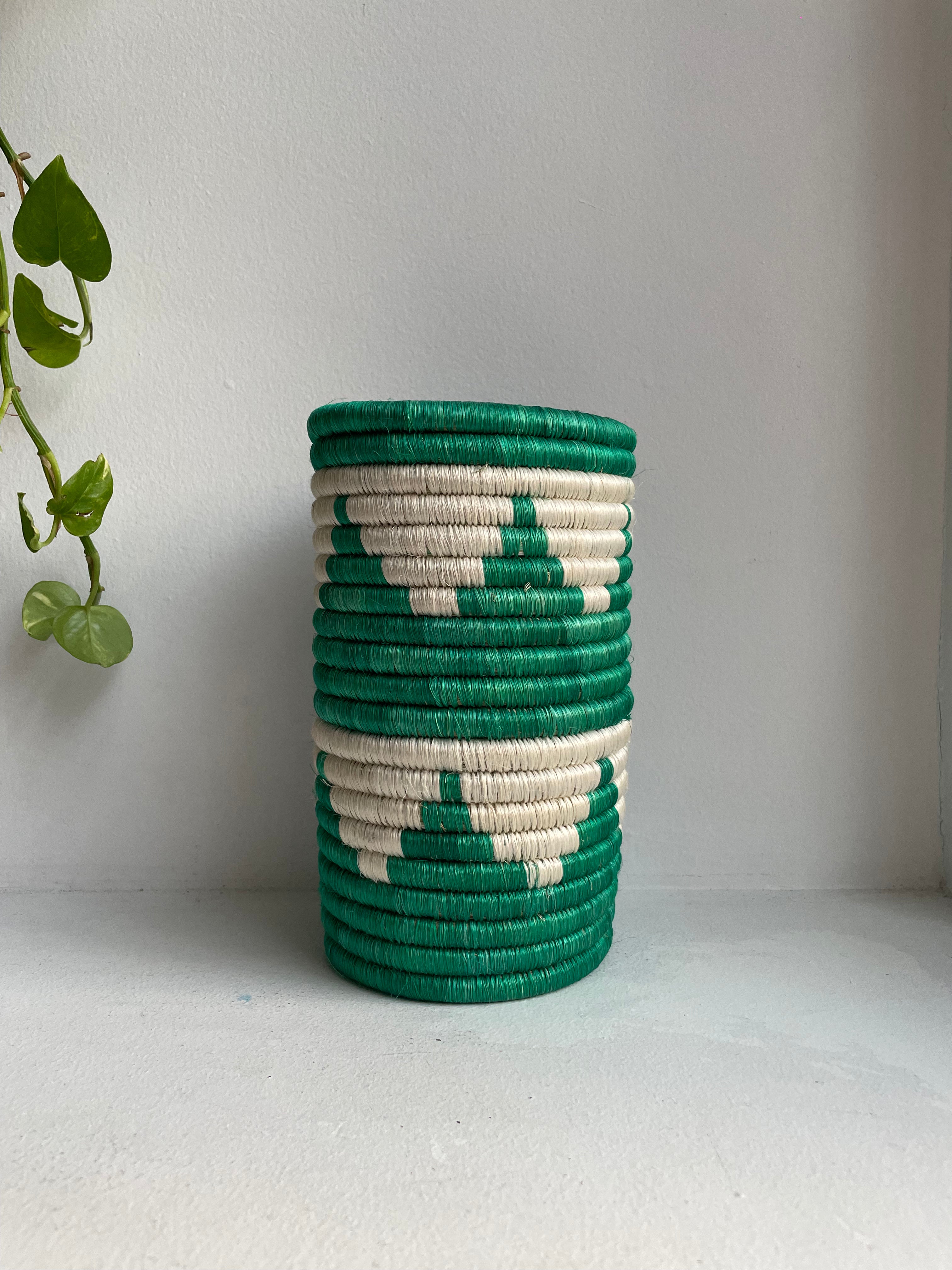 Display of green and white triangle vase