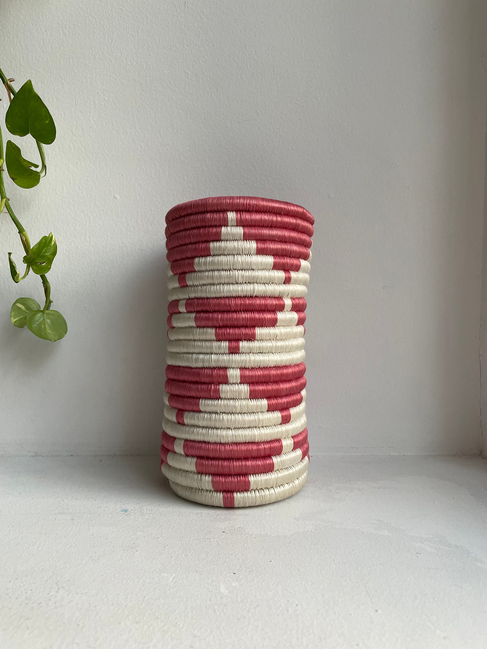 Display of rose pink and white triangle vase