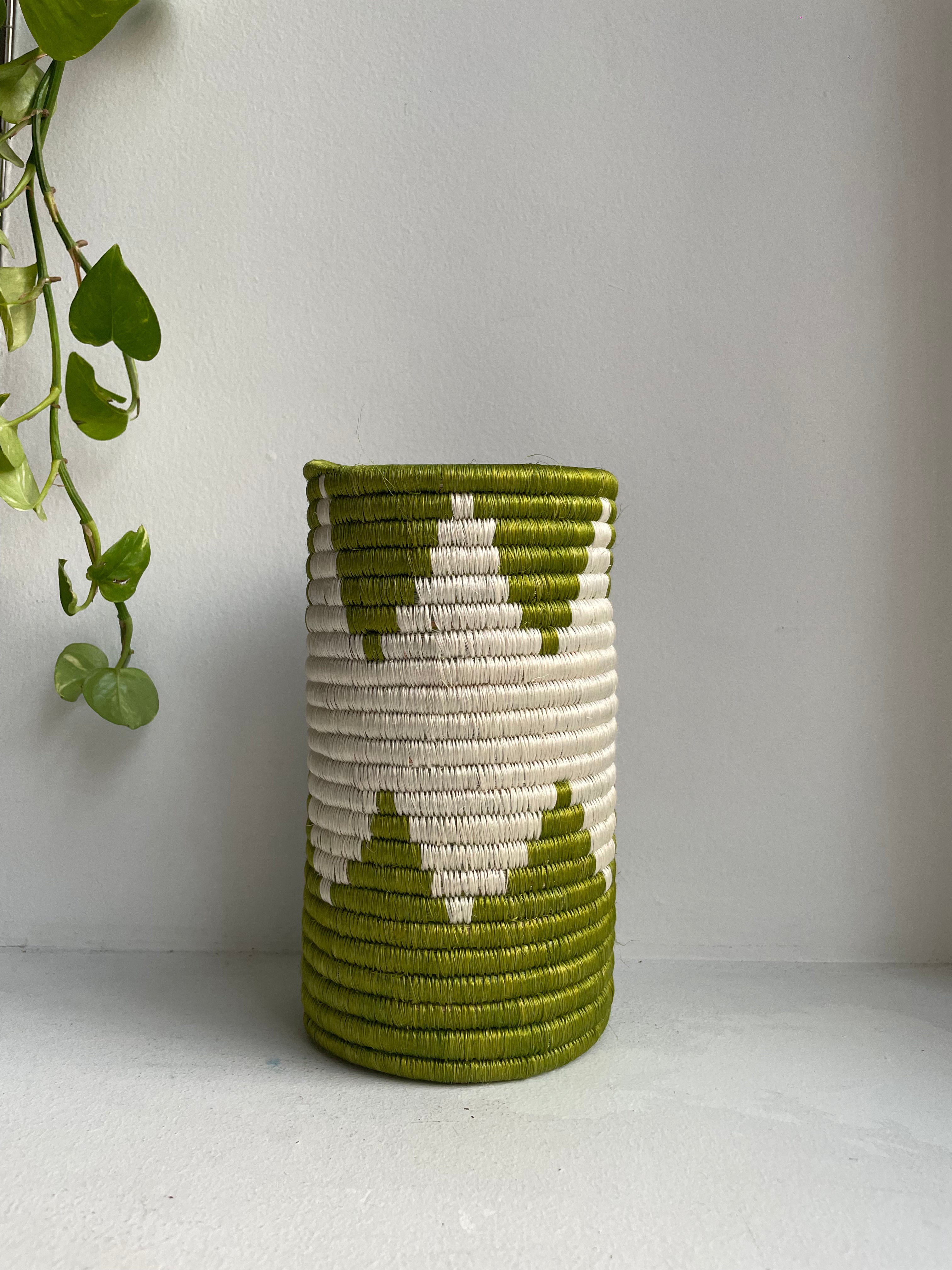 Display of grass green and white colored vase