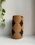 Display of beige and black diamond  vase