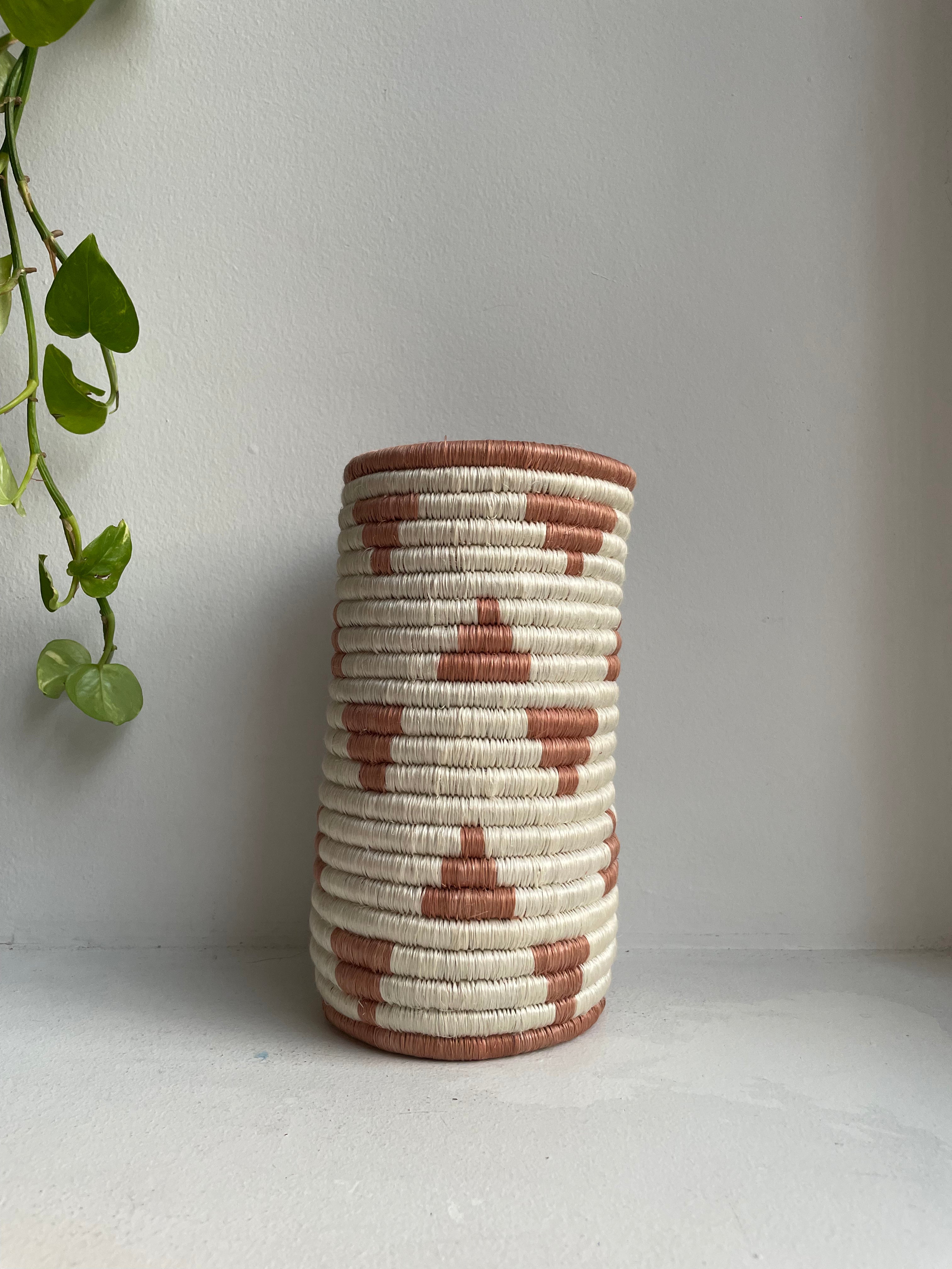 Display of white and cinnamon triangle vase