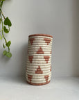 Display of white and cinnamon triangle vase