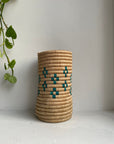 Display of beige and teal colored vase