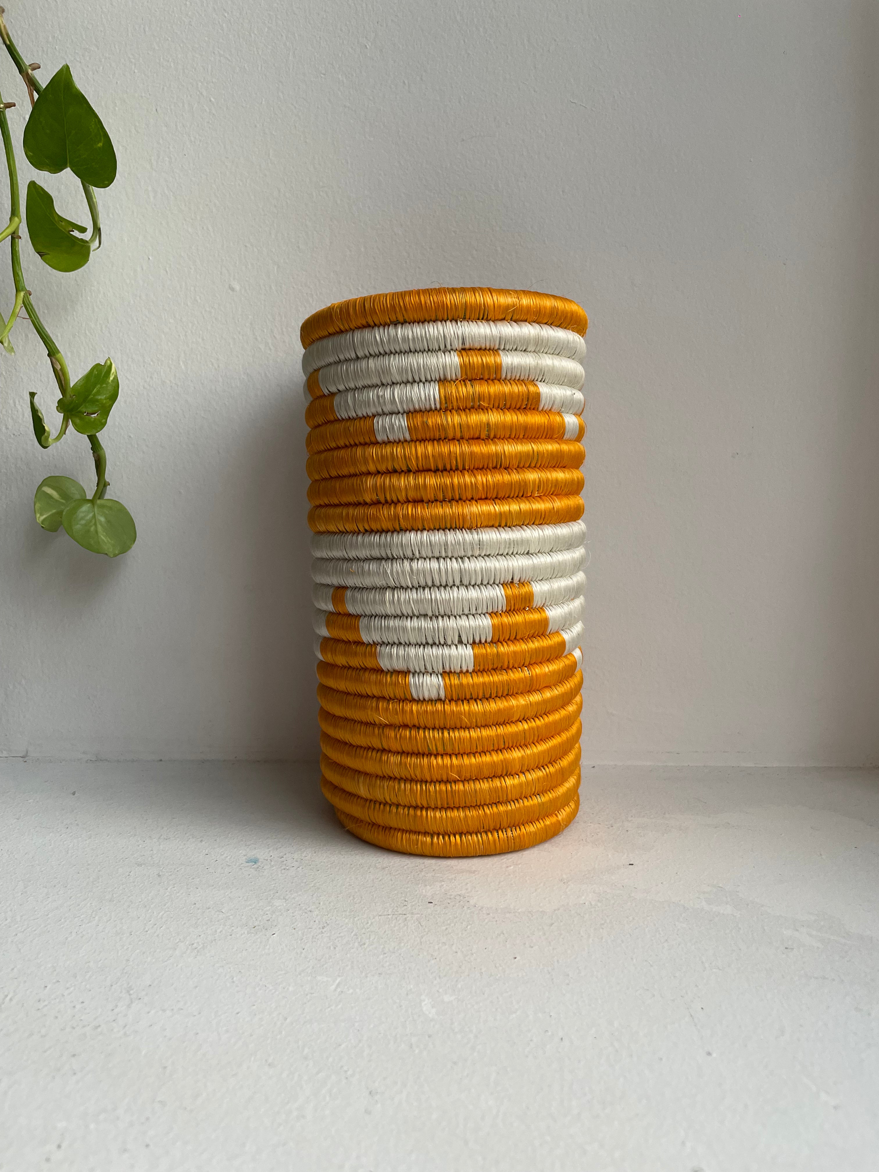 Display of white and turmeric vase 