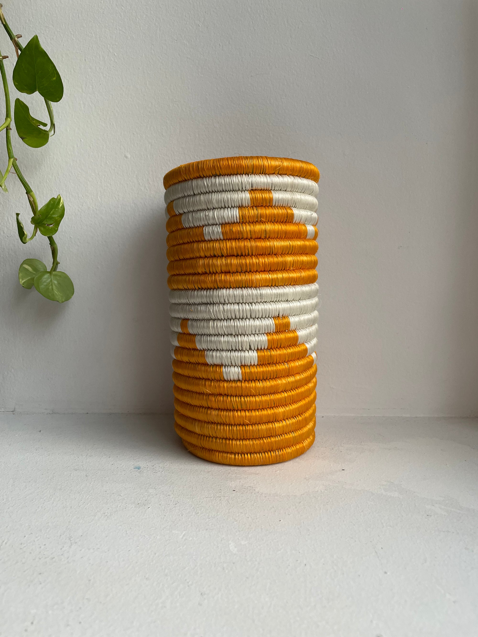 Display of white and turmeric vase 