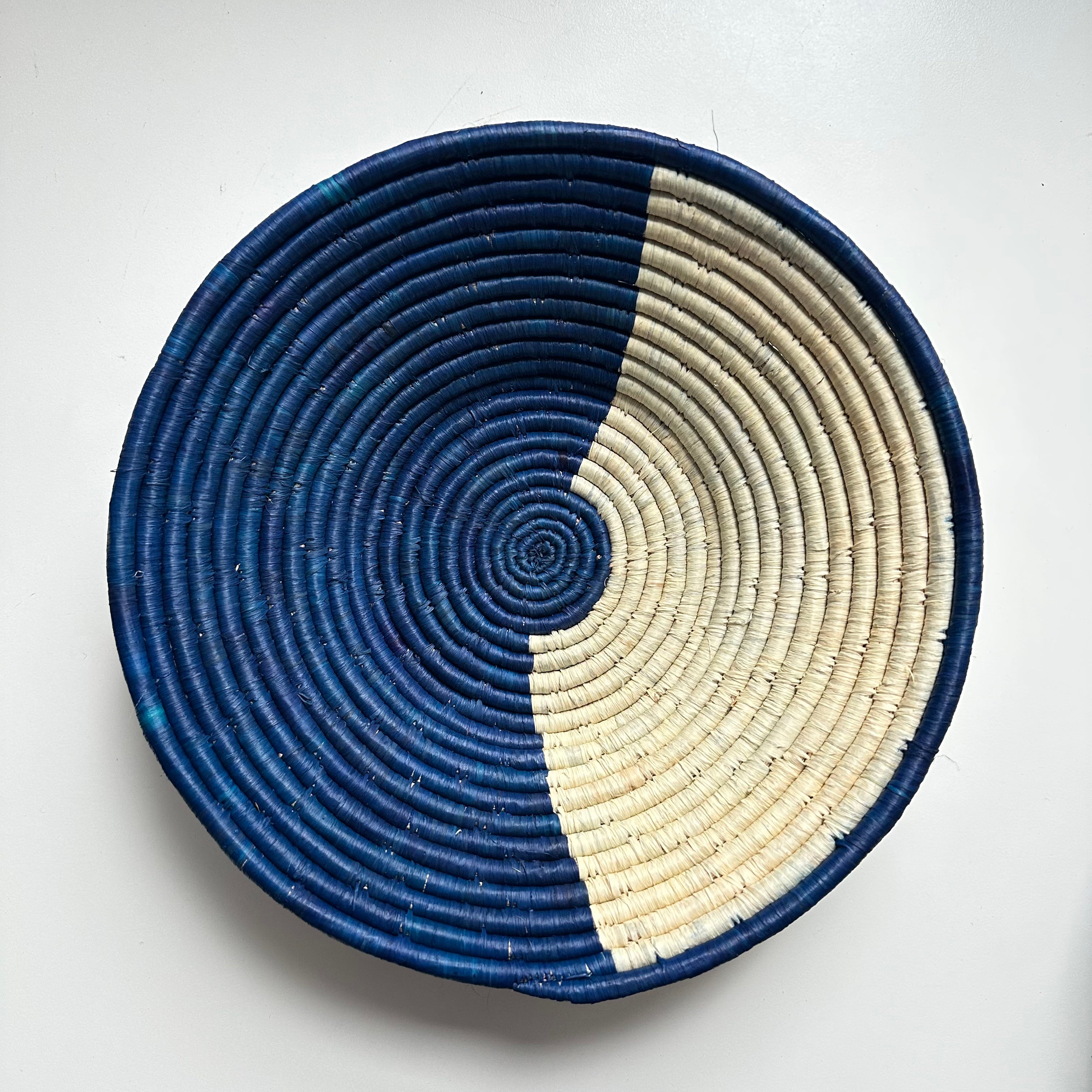 The display of blue and natural color handwoven bowl