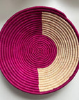 The display of pink and natural color handwoven bowl