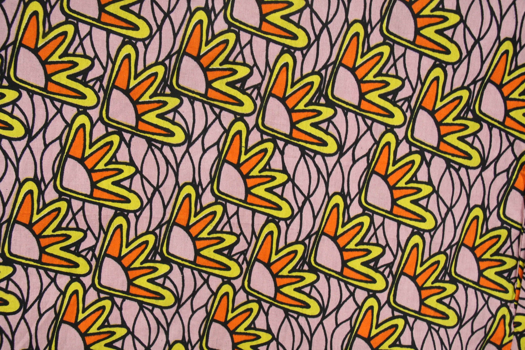 Close up display of beige sunflower print dress, fabric.