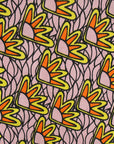 Close up display of beige sunflower print dress, fabric.