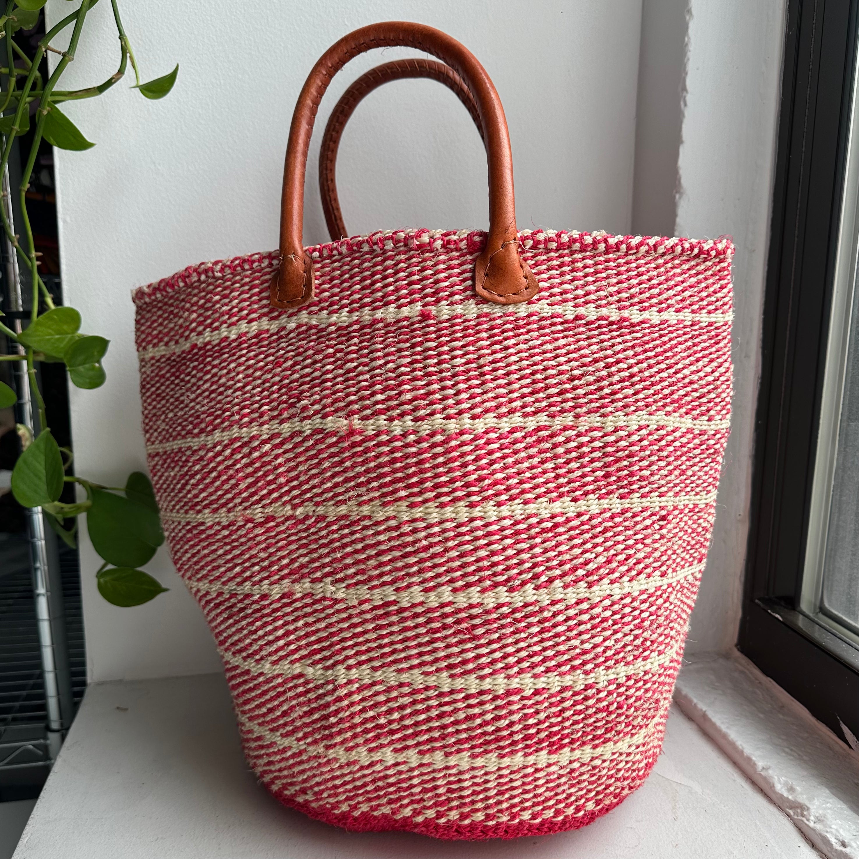 pink woven striped handle basket