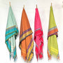 Colorful scarves hanging on clothes line