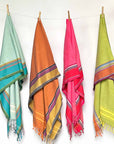 Colorful scarves hanging on clothes line